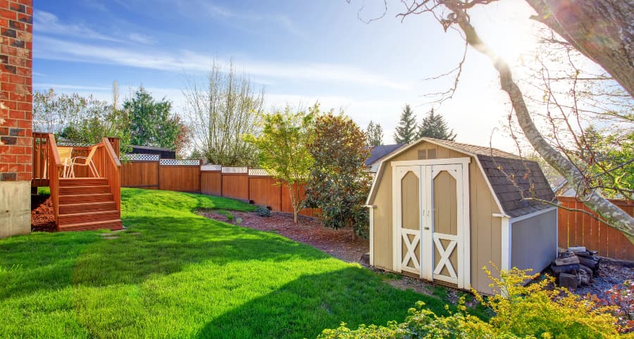 Fenced backyard with storage shed in Salinas